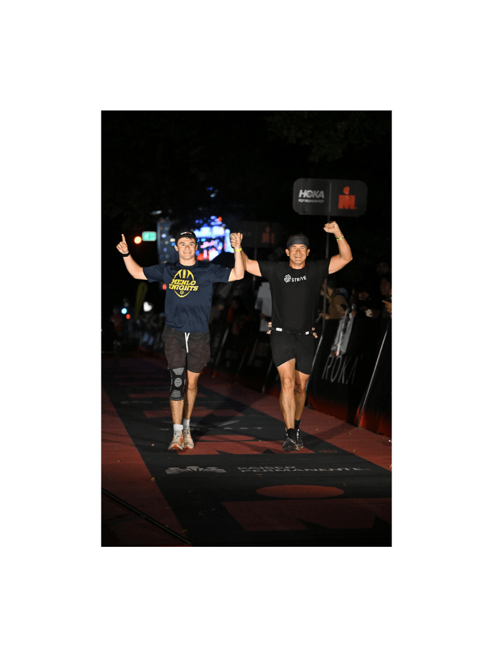 man and son finishing ironman