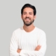 headshot of man on gray background