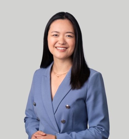 headshot of woman in blue blazer