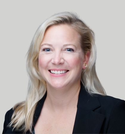 Headshot of woman on gray background