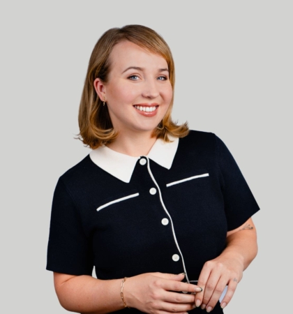 headshot of woman on gray background