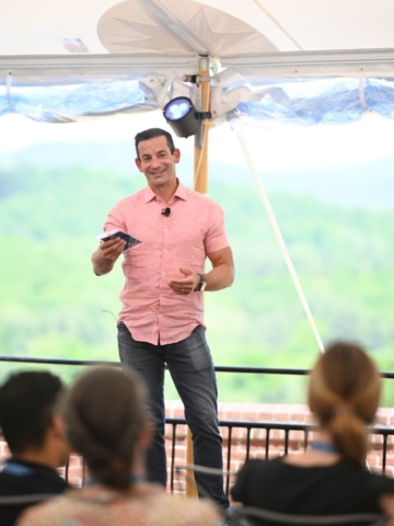 man speaking to audience