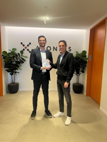 two men in front of company sign at Axonious headquarters