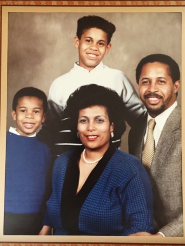 Old family photo with a mother, father, and two sons