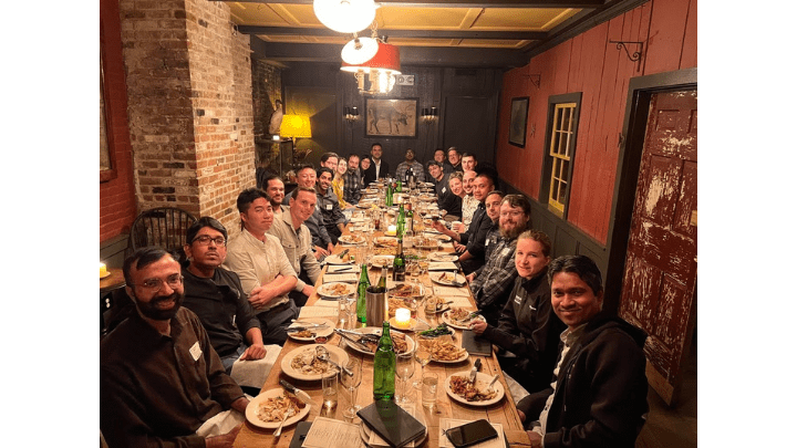 large group sitting around a dinner table