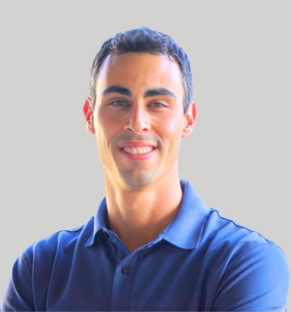 headshot of man in blue shirt